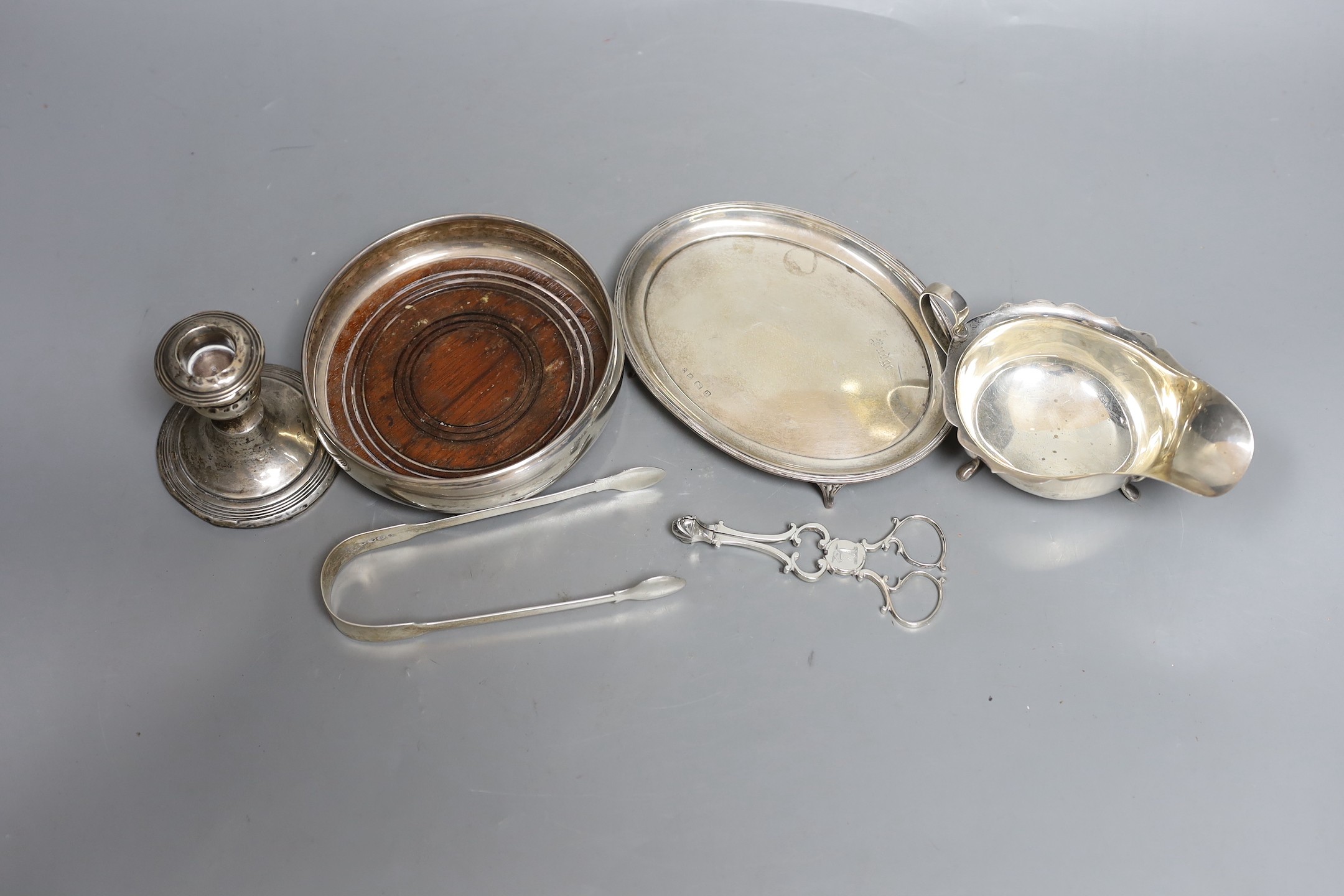 Assorted small silver, including a George V oval teapot stand, a modern mounted wine coaster, pair of sugar nips, etc.